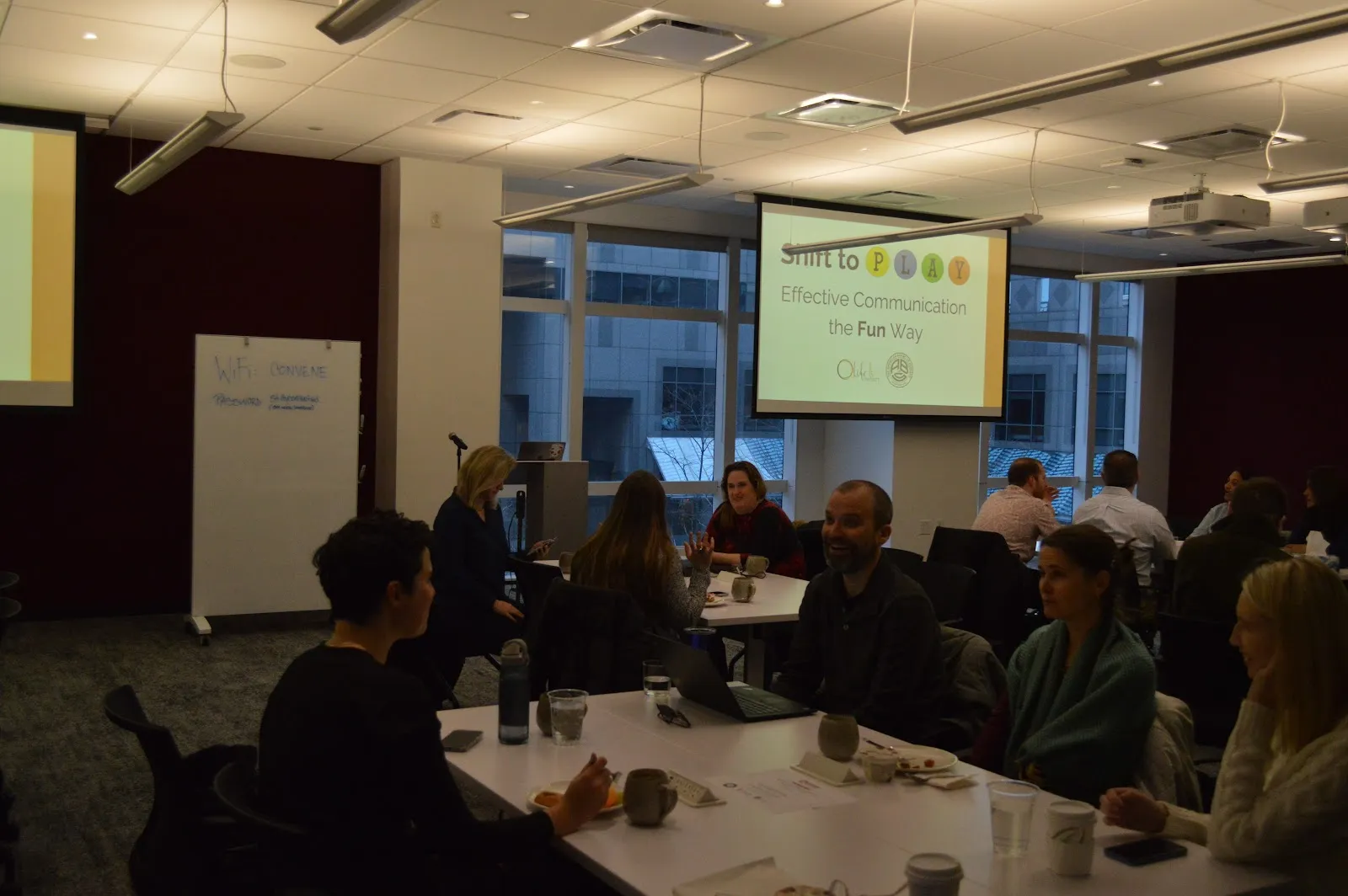 Yoshee leading a workshop in a conference room