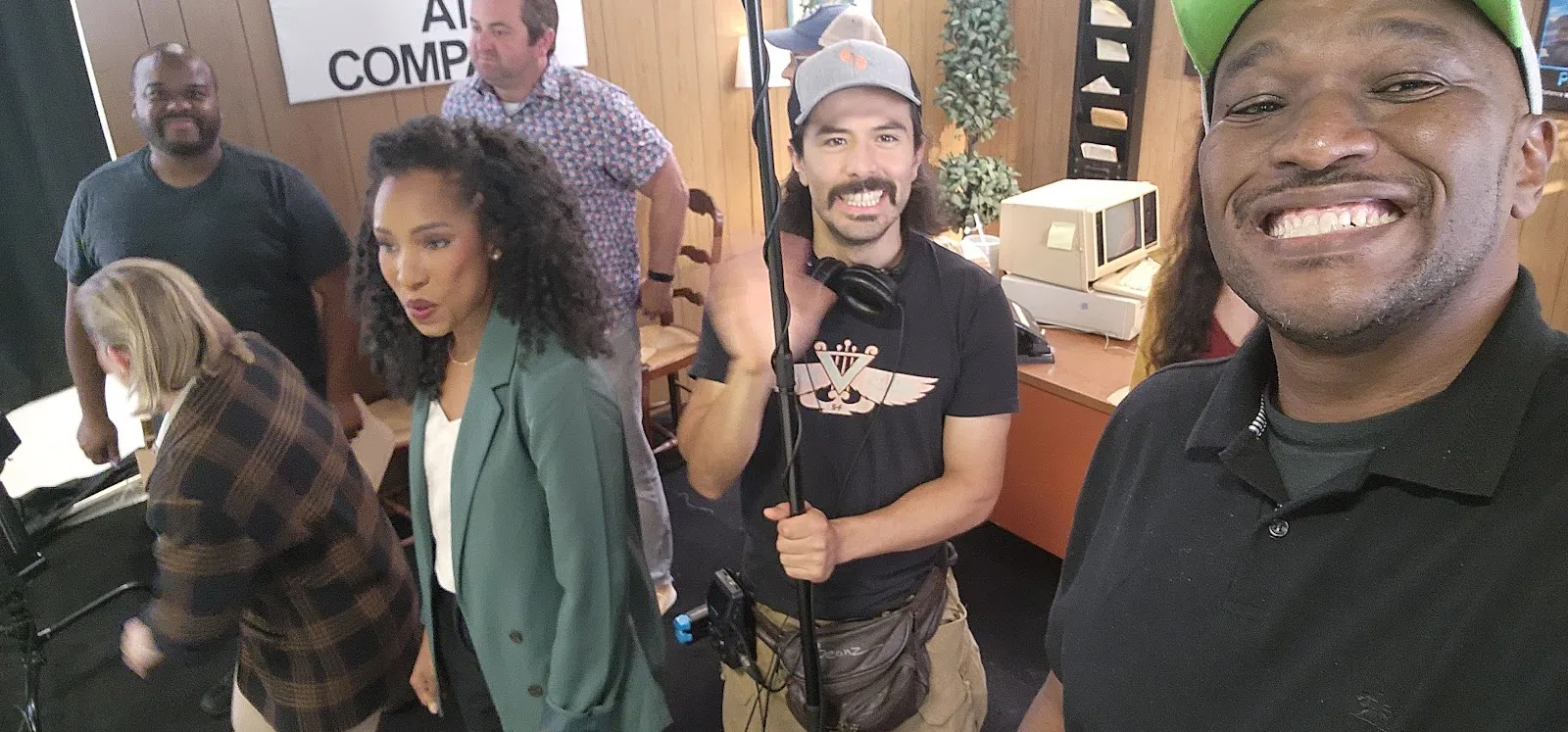 Real production team members sharing a candid moment on set