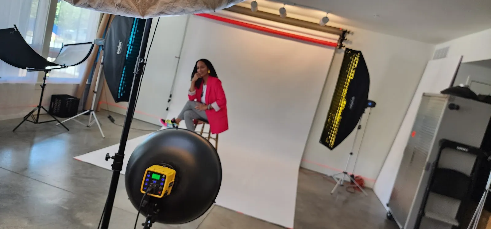 Yoshee in a pink blazer during a studio portrait session